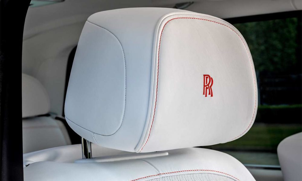 Bespoke Rolls-Royce Cullinan in Fux Orange - Interior - Front Seat Headrest